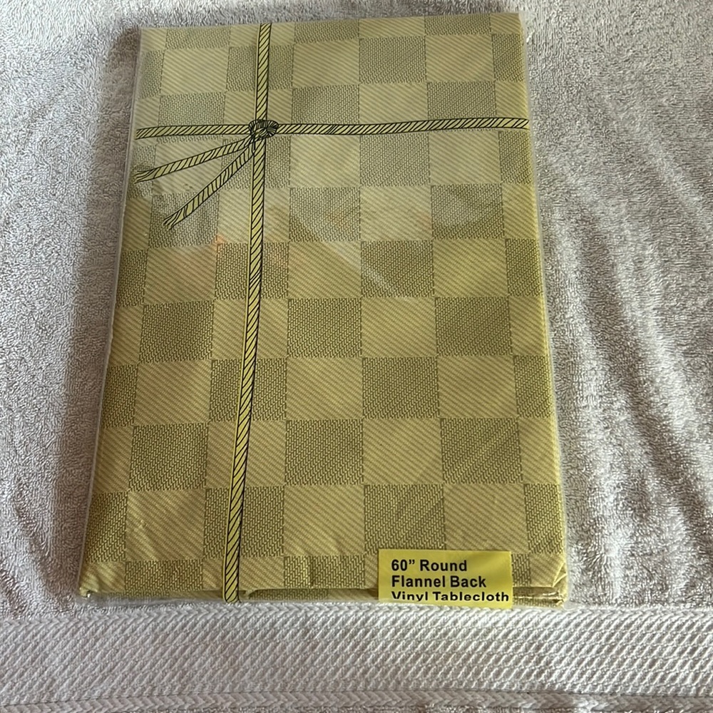 60' Round Vinyl Tablecloth with felt material under